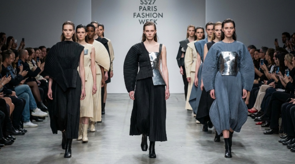 Models walking the SS27 Paris Fashion Week runway in sculptural womenswear silhouettes